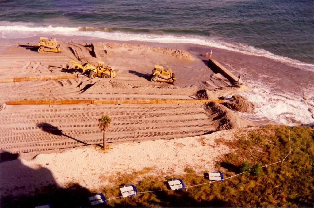 Beach reclamation, northern Broward County Florida, August 1996. Dredges pump sand in from sea floor off shore onto the