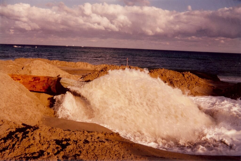 Beach reclamation, northern Broward County Florida, August 1996. Dredges pump sand in from sea floor off shore onto the