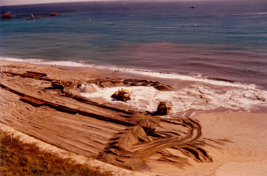 Beach reclamation, northern Broward County Florida, August 1996. Dredges pump sand in from sea floor off shore onto the