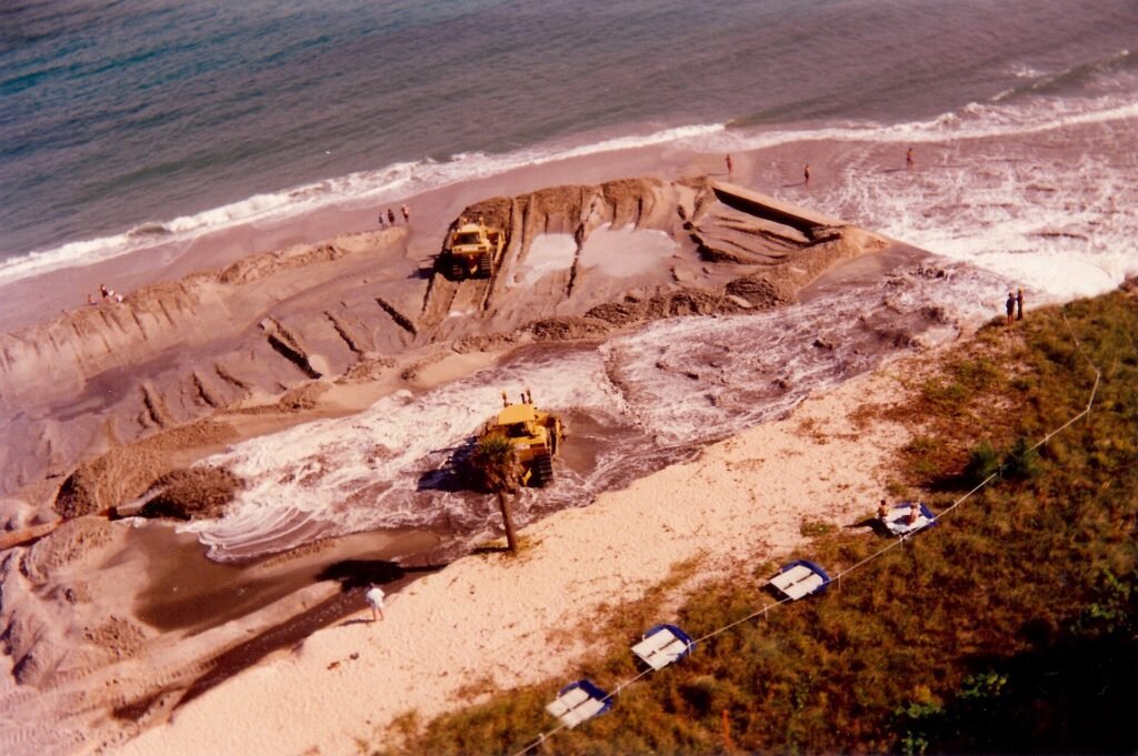 Beach reclamation, northern Broward County Florida, August 1996. Dredges pump sand in from sea floor off shore onto the
