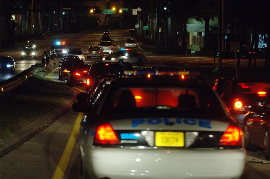 Miami, FL, October 29, 2005 -- Local police check cars that are coming out to Miami Beach because of the curfews set up