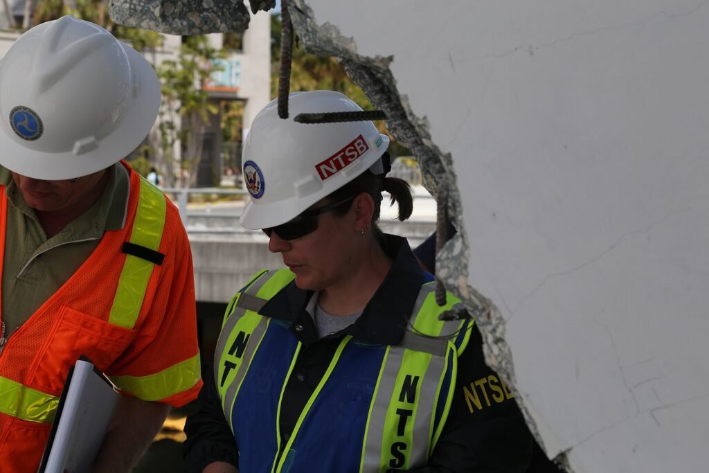 MIAMI (March 17, 2018) — Bridge design specialist Reggie Holt, of the Federal Highway Administration (left) and NTSB’s A