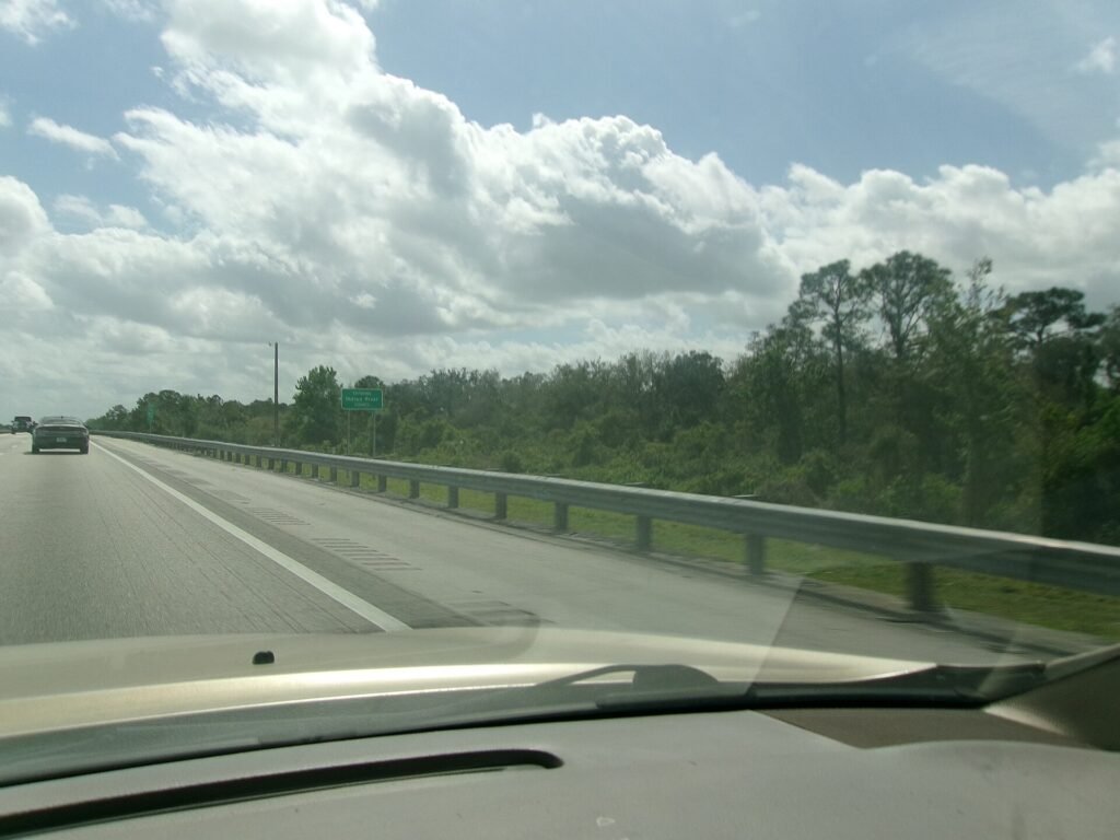 Southbound on Florida's Turnpike as it approaches a sign telling motorists that they're about to leave Osceola County an