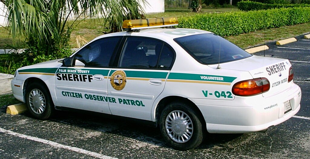 Palm Beach County, Florida, Sheriff's "Citizens Observer Patrol" (COP) volunteer vehicle. The car is a Chevrolet Malibu